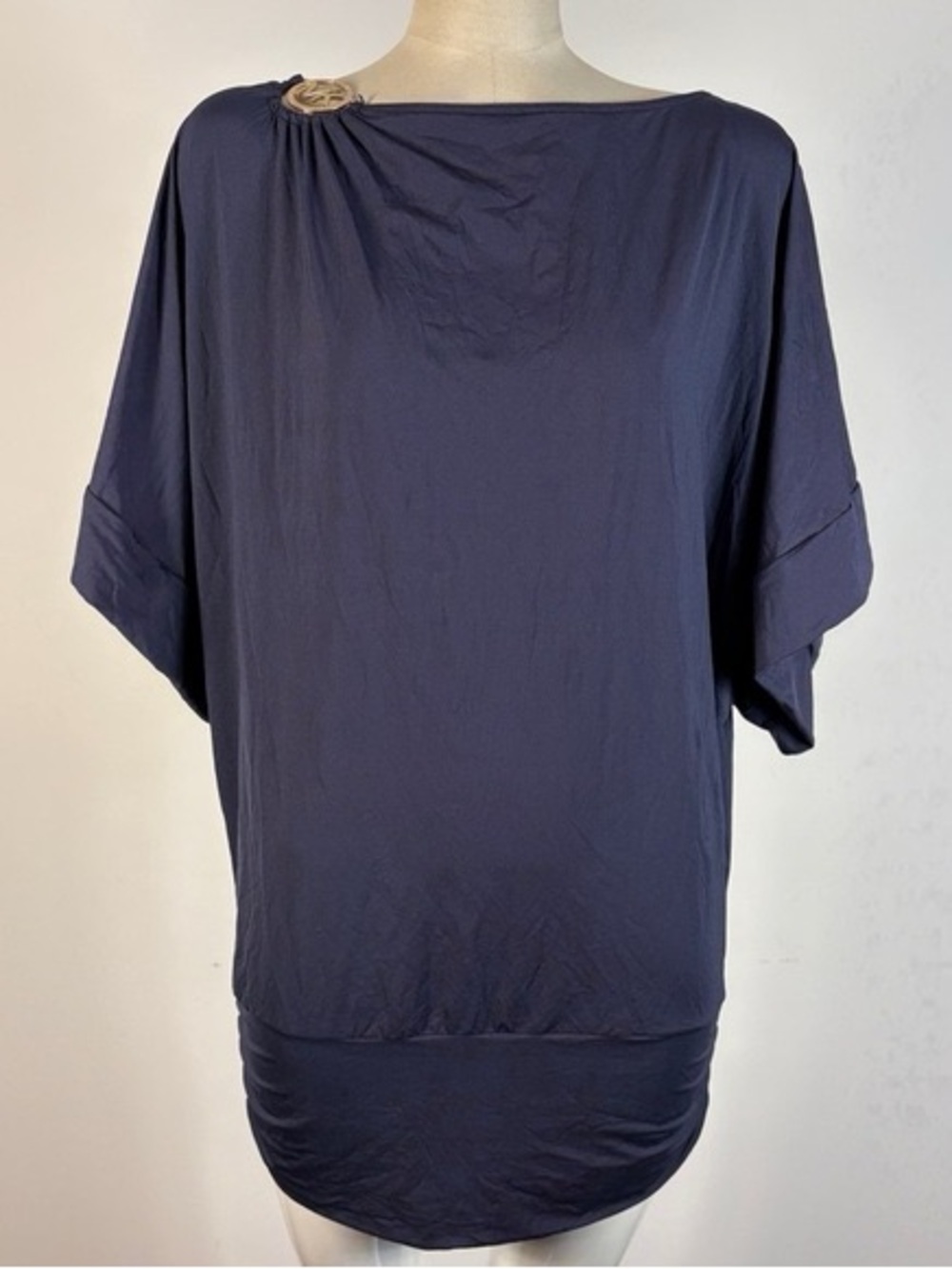 Michael Kors dolman-sleeve top featuring a signature gold-tone MK logo hardware
